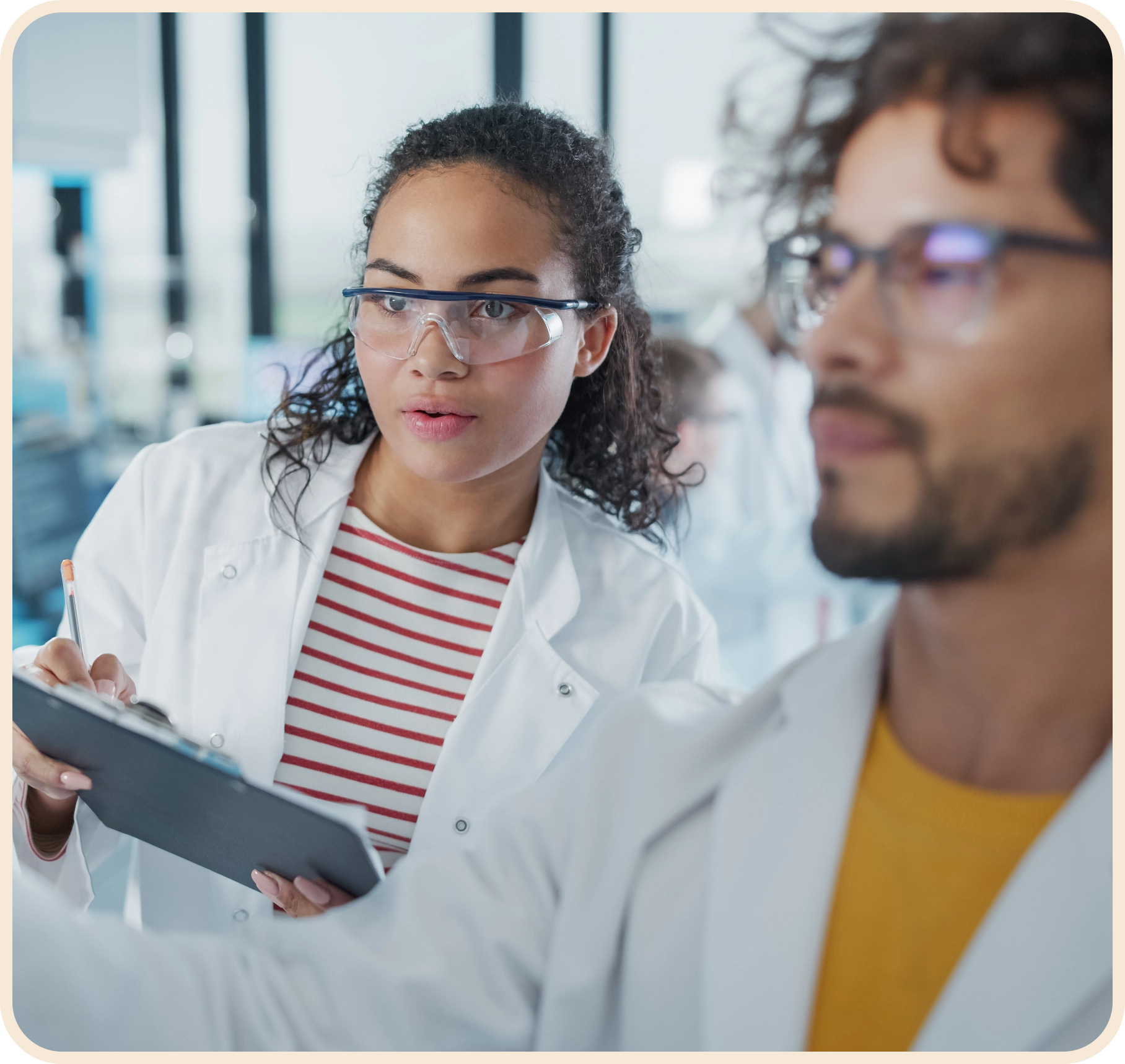 two researchers looking at screen